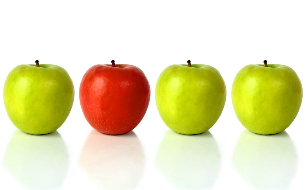 One red apple with three green apples