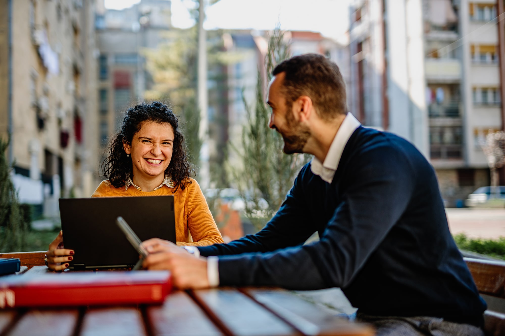 Website design and marketing for small law firms 1 Attorney and website developer sitting together discussing website design and marketing for small law firms