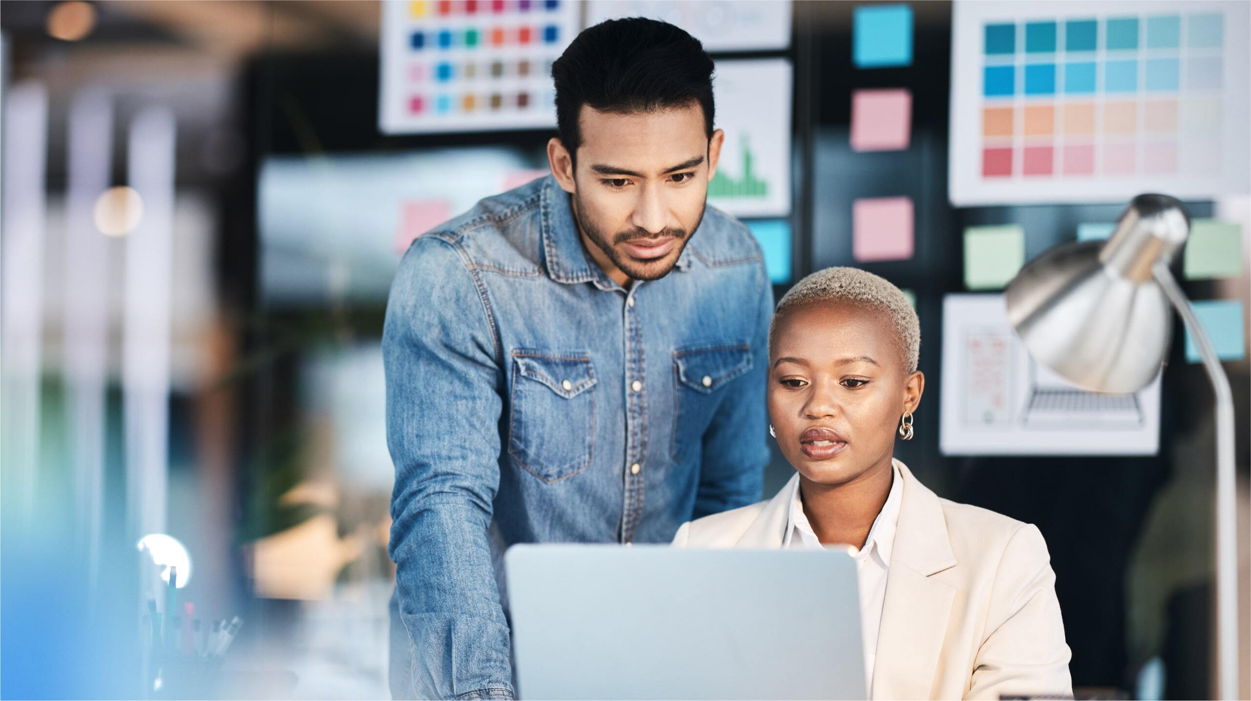 What is a conversion in marketing? Metrics that matter 1 A man and a woman looking at a computer screen looking at metrics that matter