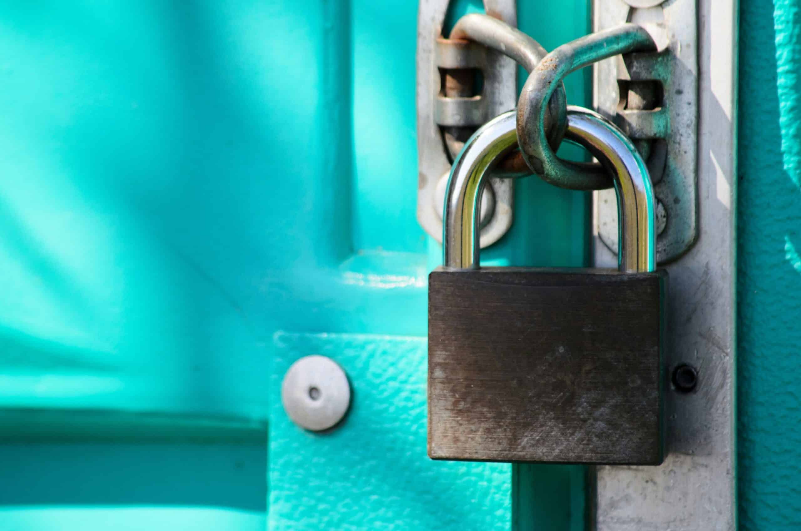 Copyright and AI: The question of human authorship 1 A lock, signifying the protections that copyright and AI represent. It locks a bright turquoise door.