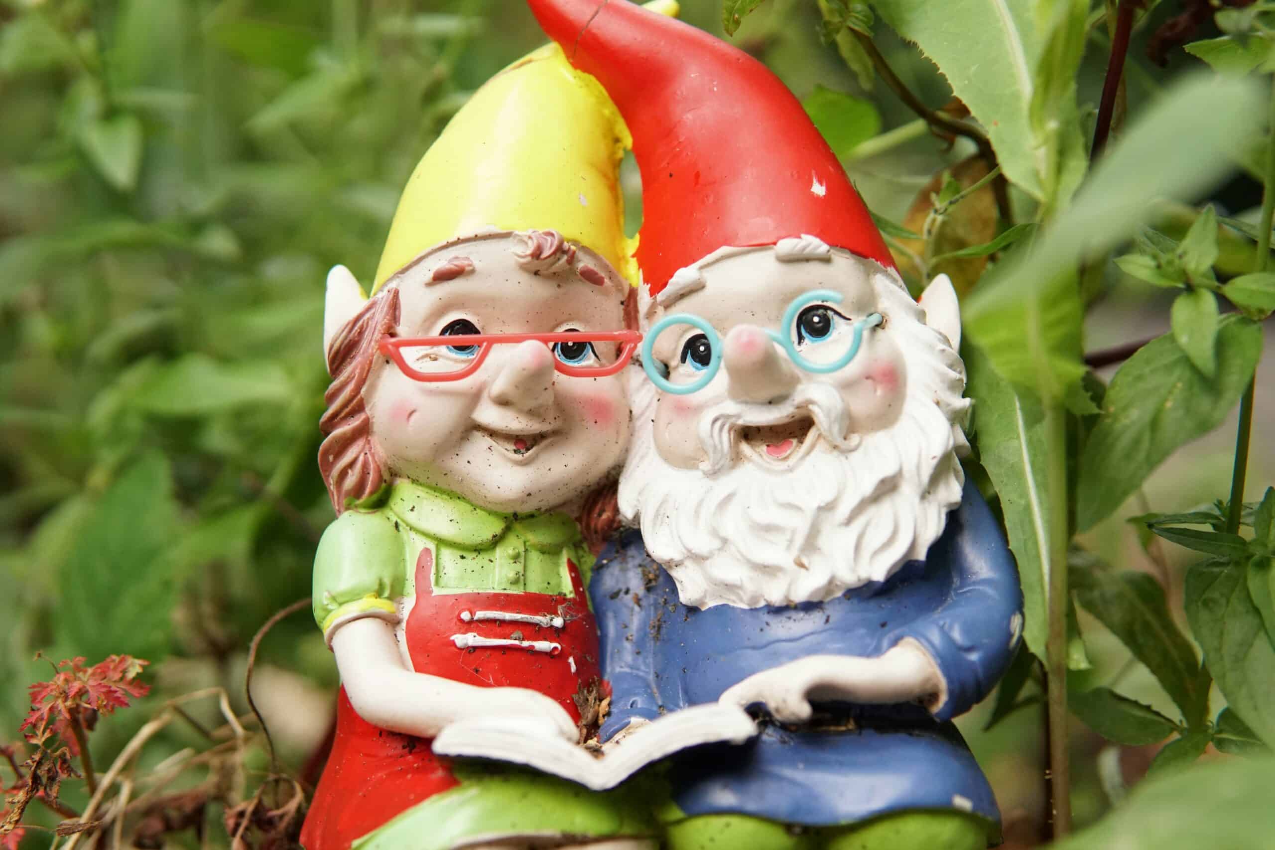 The invisible work behind effective content 1 A garden statue of a male and female gnome sitting together with a book.