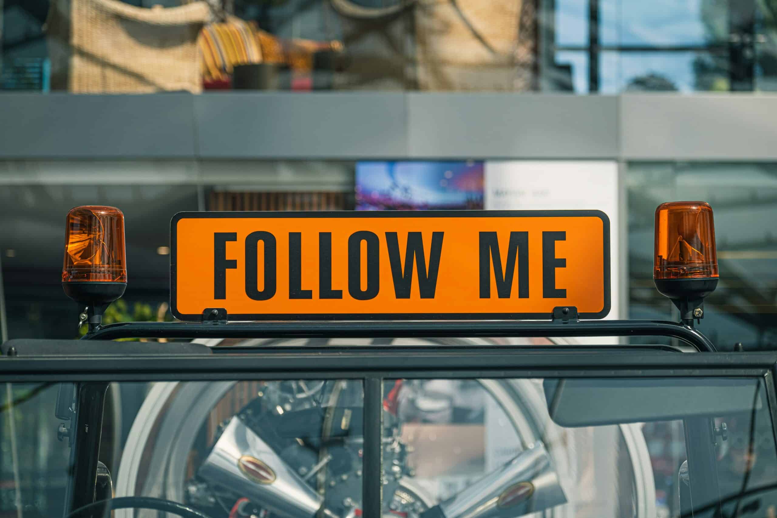 The rise of attorney influencers: Building trust and visibility in a distracted age 1 An orange sign that says, "follow me." A playful reference to following an influencer on social media.