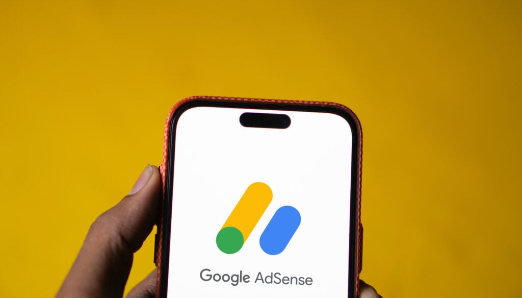 The Rising Cost of Google AdWords Auctions 2 Google Ads logo is displayed on smartphone.