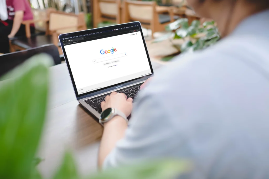 The Rising Cost of Google AdWords Auctions 3 A man is typing on Google search engine from a laptop. Google is the biggest Internet search engine in the world