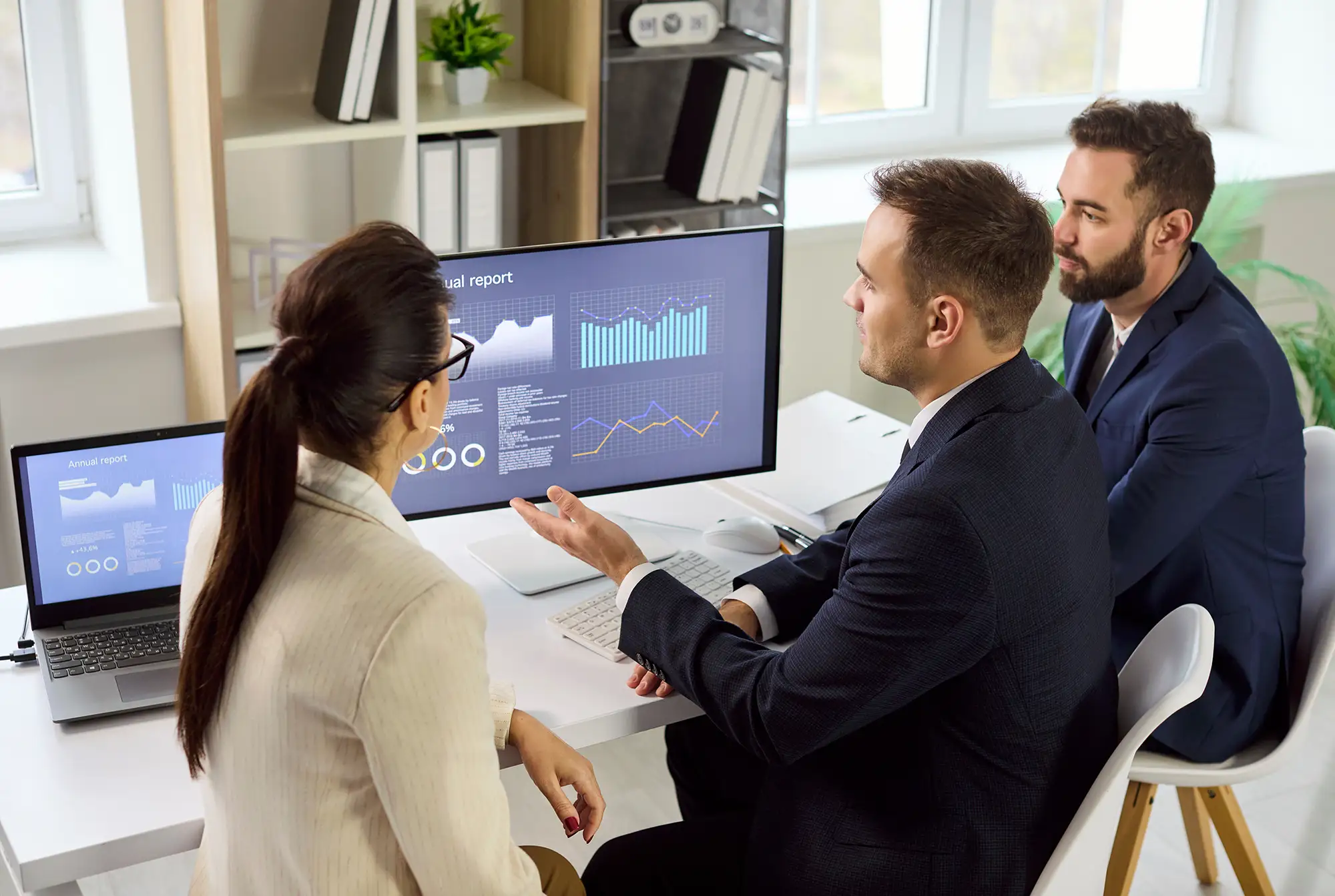 Getting a Clearer Audience Picture with Server-Side Tracking 2 Marketing team reviewing website analytics dashboard showing visitor behavior and campaign performance data