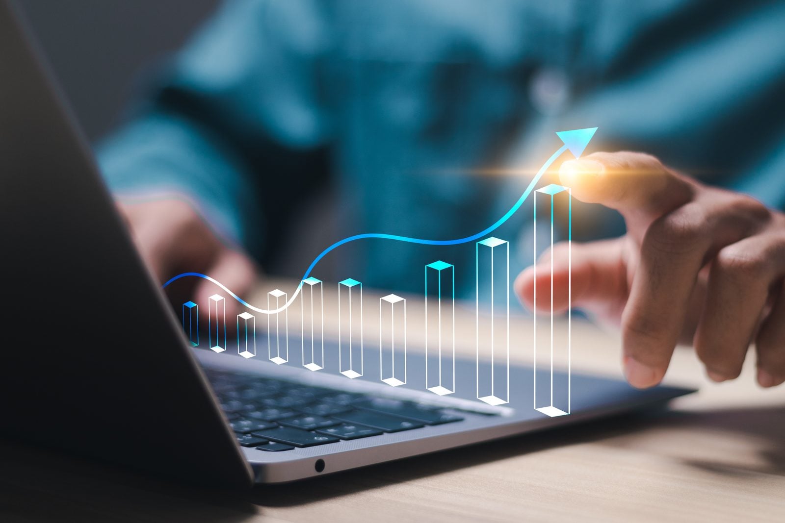 A 41% Increase in Yearly Signed Cases: How Agentic Marketing Helps Crosley Law Rise in Visibility 2 Person pointing at a rising bar chart and growth arrow projected over a laptop